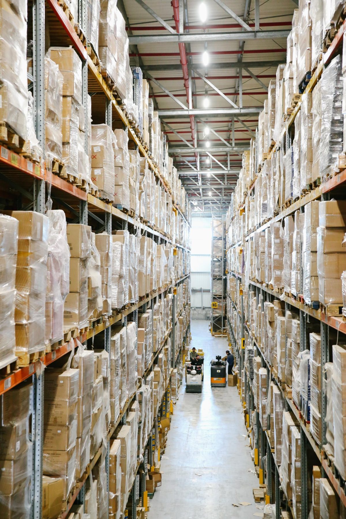 A distribution warehouse aisle with high pallet racking