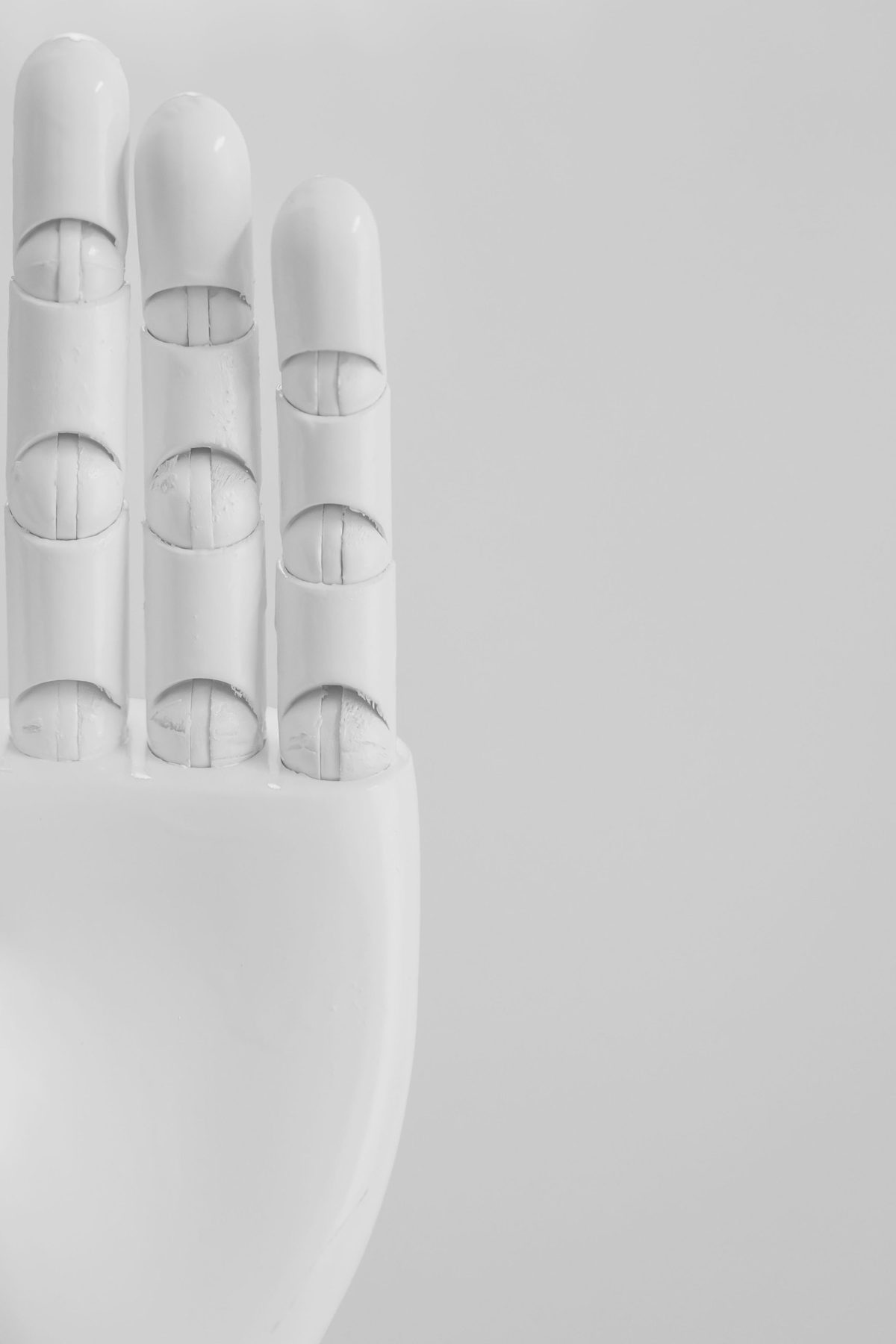 Articulated robotic fingers in white