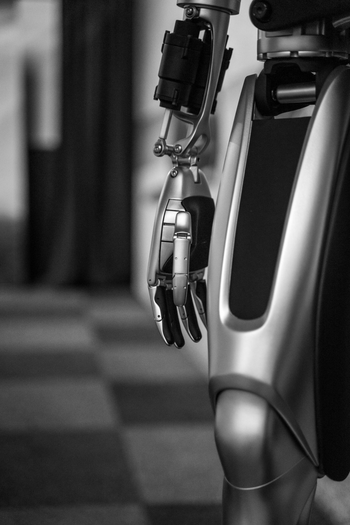 Close-up of a humanoid robot's arm and dexterous hand