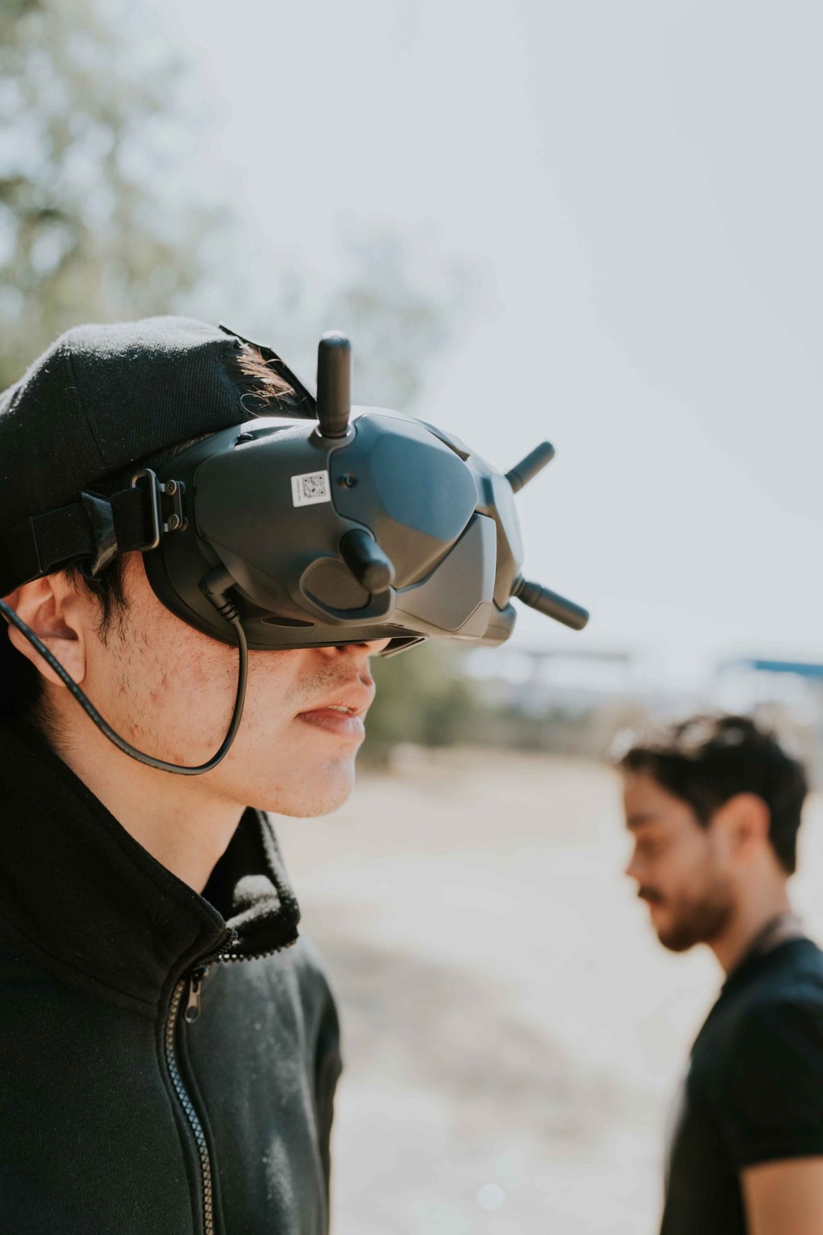 A person wearing immersive FPV goggles